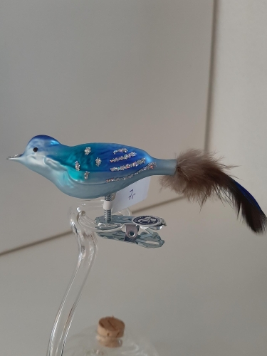Vogel blau mit Feder